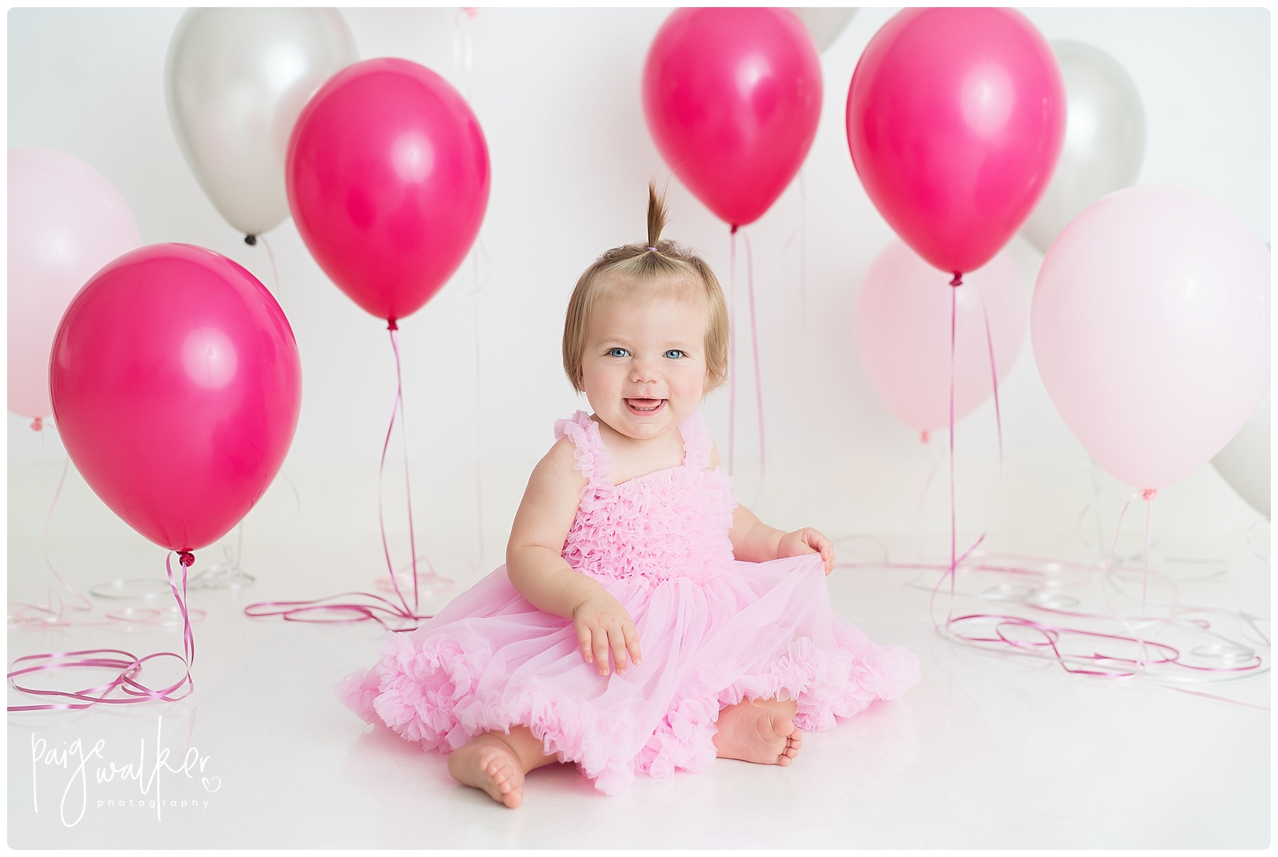girl in the studio for her 1 year birthday