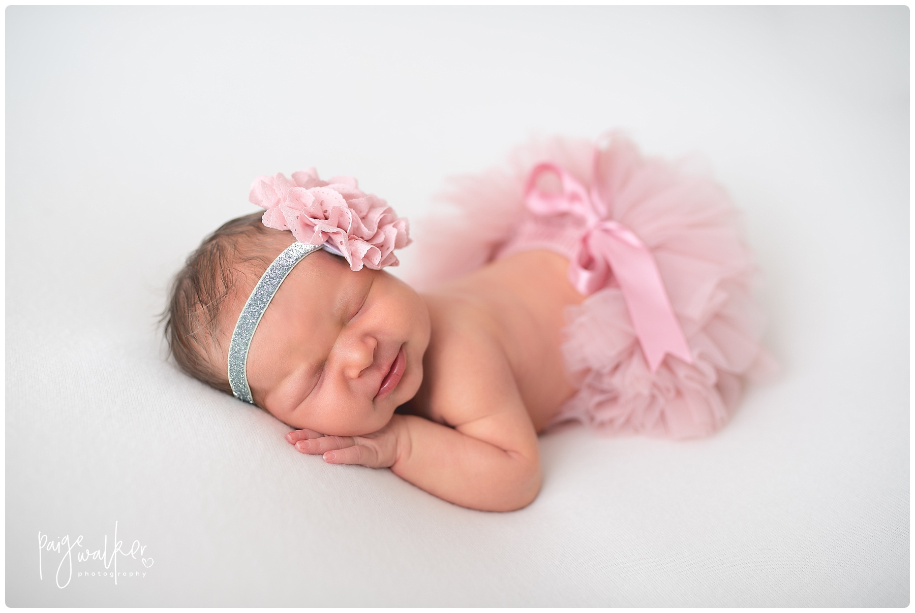 newborn girl wearing a pink tutu