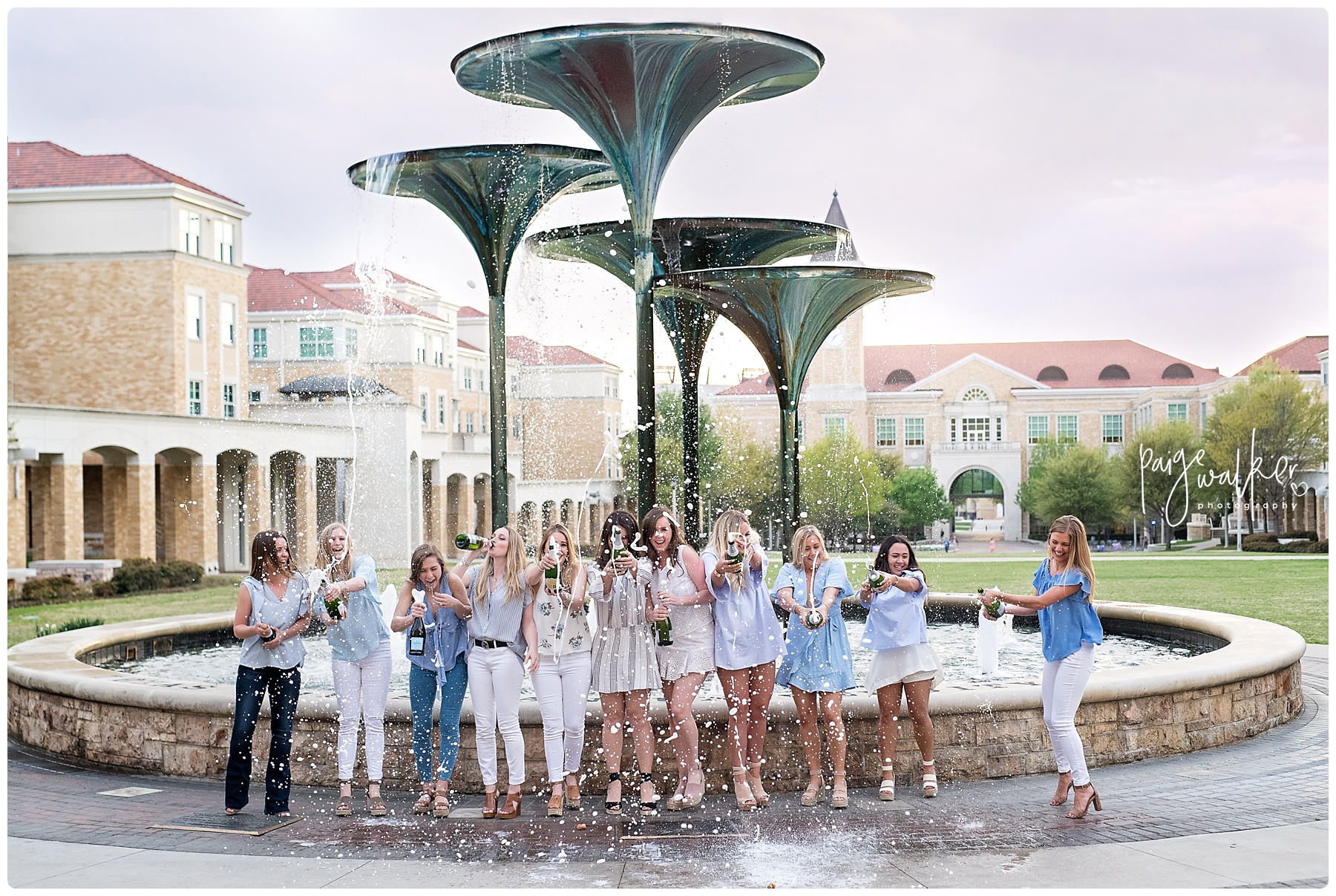 Group of TCU friends spraying Champagne to celebrate graduating