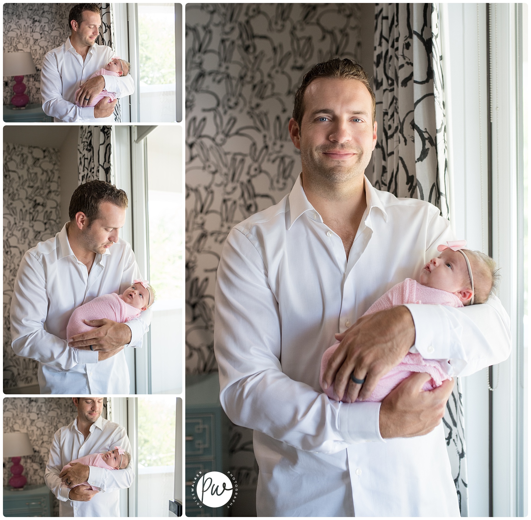 dad holding his newborn girl in the nursery