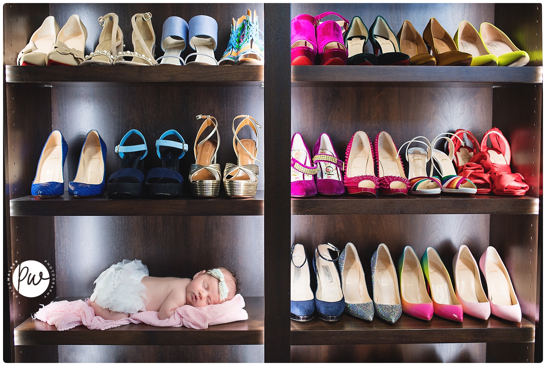 newborn girl laying with all her moms shoes