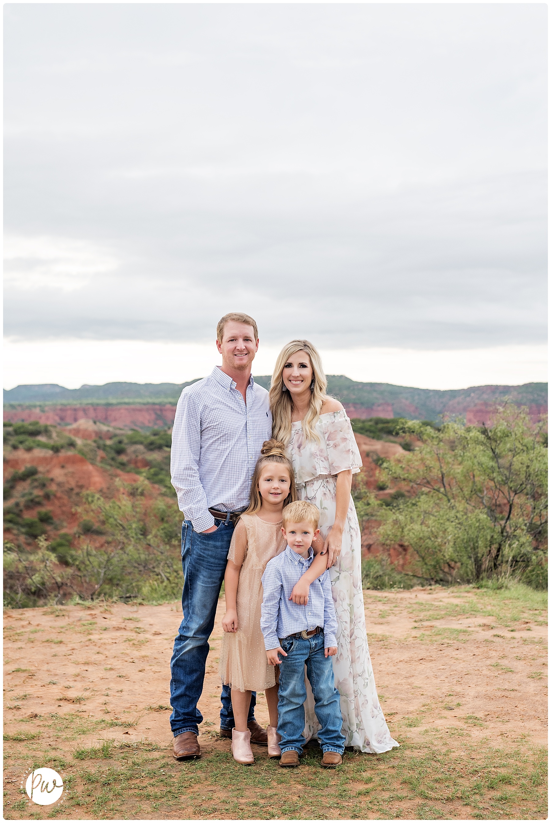 family of four standing in front of a canyon in Lubbock