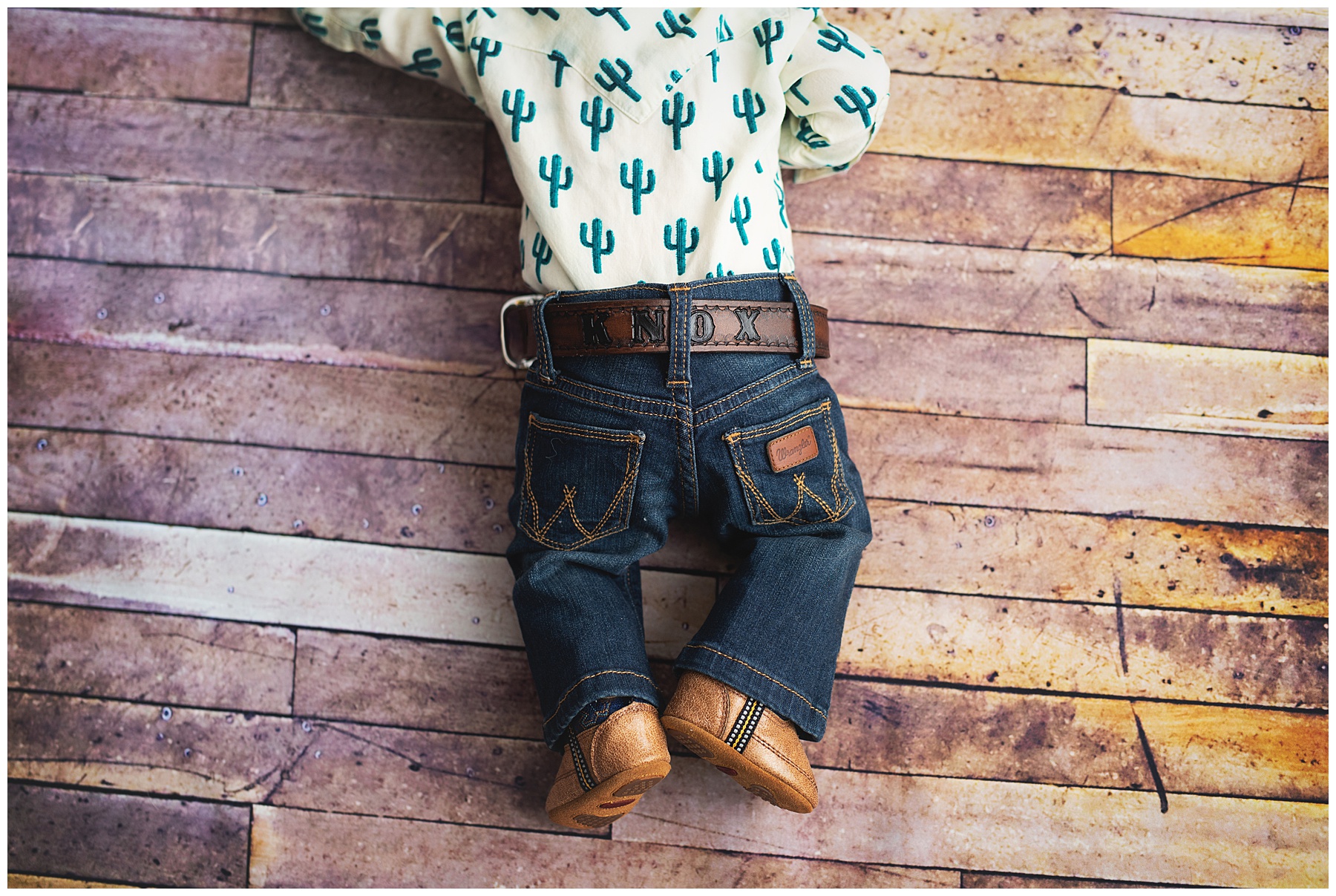 baby boy with cowboy boots and belt