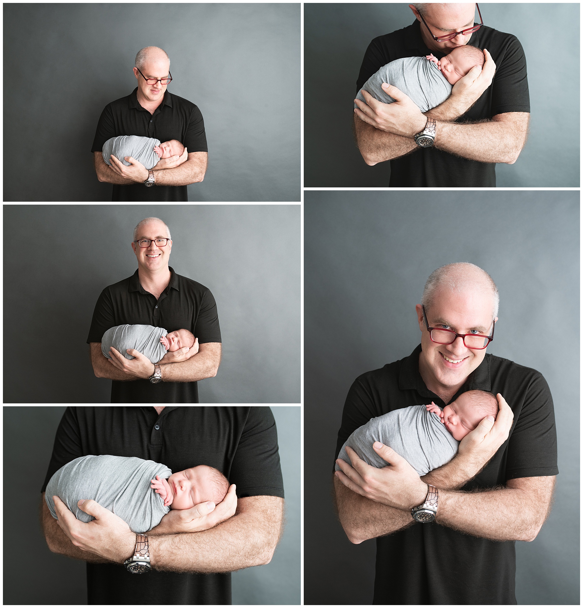 dad holding his newborn boy in the studio