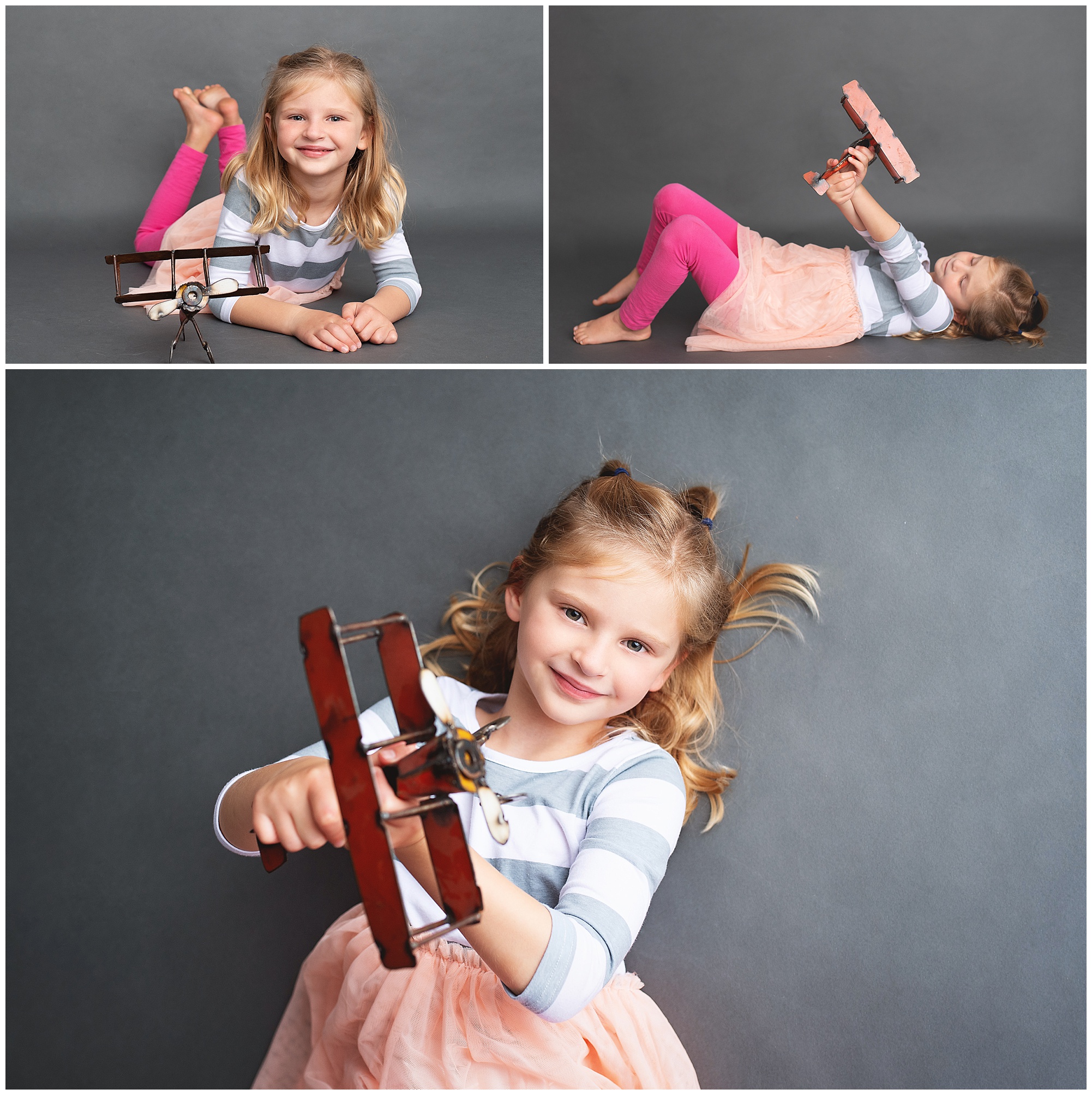 girl laying down playing with her airplane in the studio
