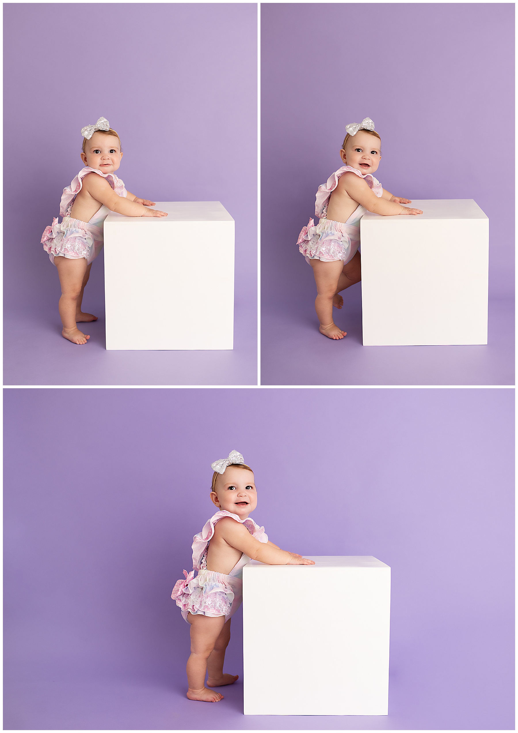 little girl using a box to help stand up for her photo session